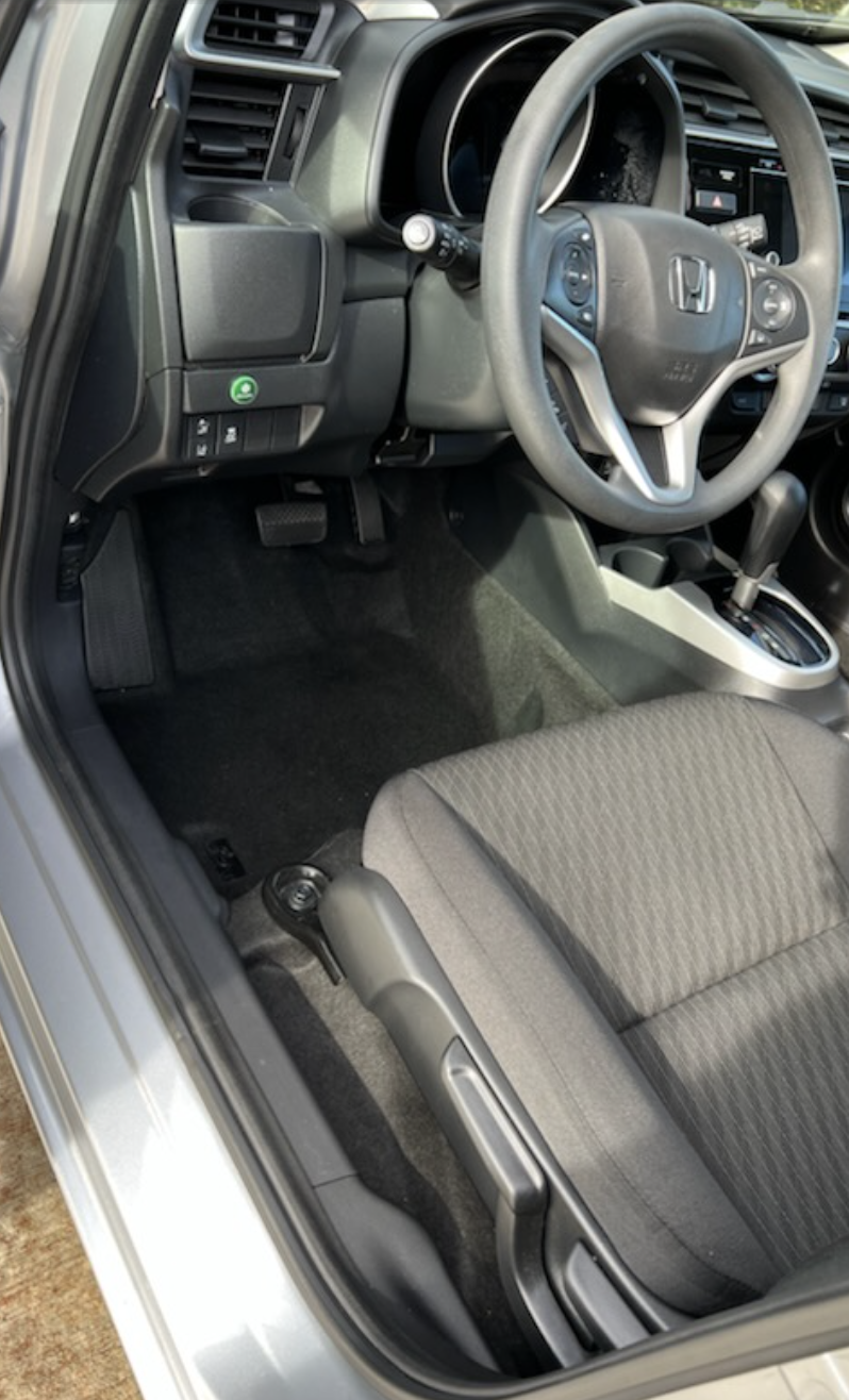 Honda Fit driver side interior vacuumed and wiped down after a full interior detail