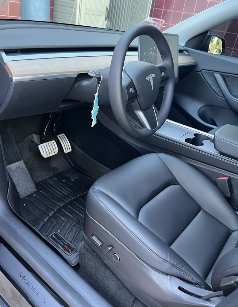 Clean black leather interior of a Tesla Model Y after interior car detailing