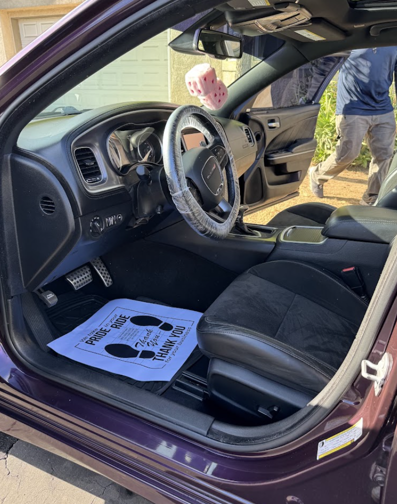 Clean black Dodge interior after a professional mobile interior detail